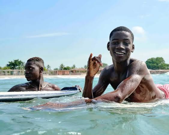 Shaded beach tents and calm ocean waters at Tarkwa Bay Beach island in Lagos Nigeria.