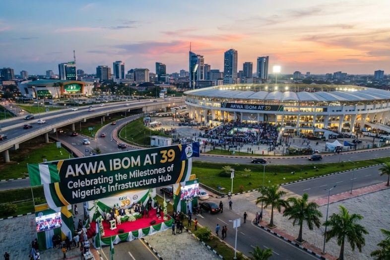 Aerial view of Akwa Ibom state celebrating its 39th anniversary with an outdoor event featuring infrastructure displays and a large commemorative banner