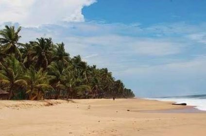 Shaded beach tents and calm ocean waters at Tarkwa Bay Beach island in Lagos Nigeria.